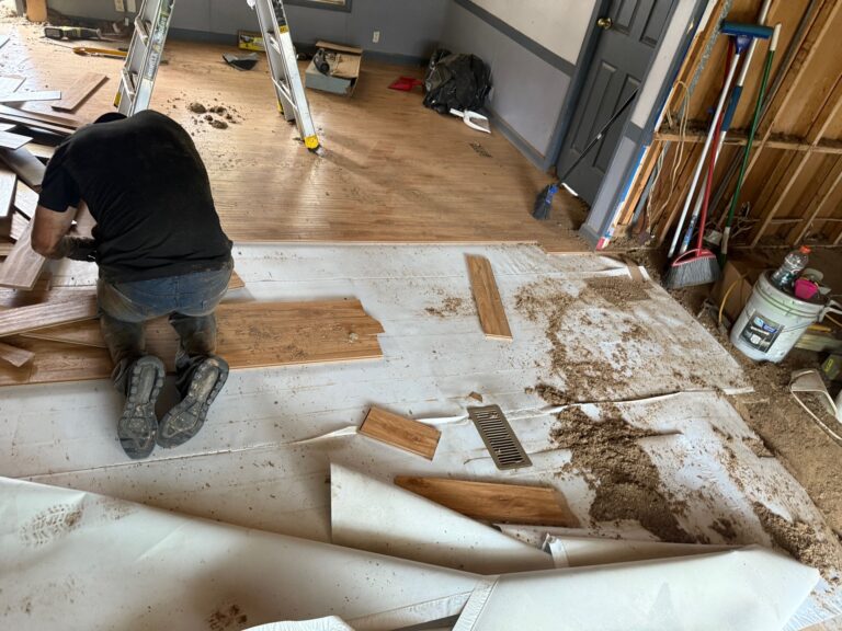 Removing damaged flooring during fire restoration